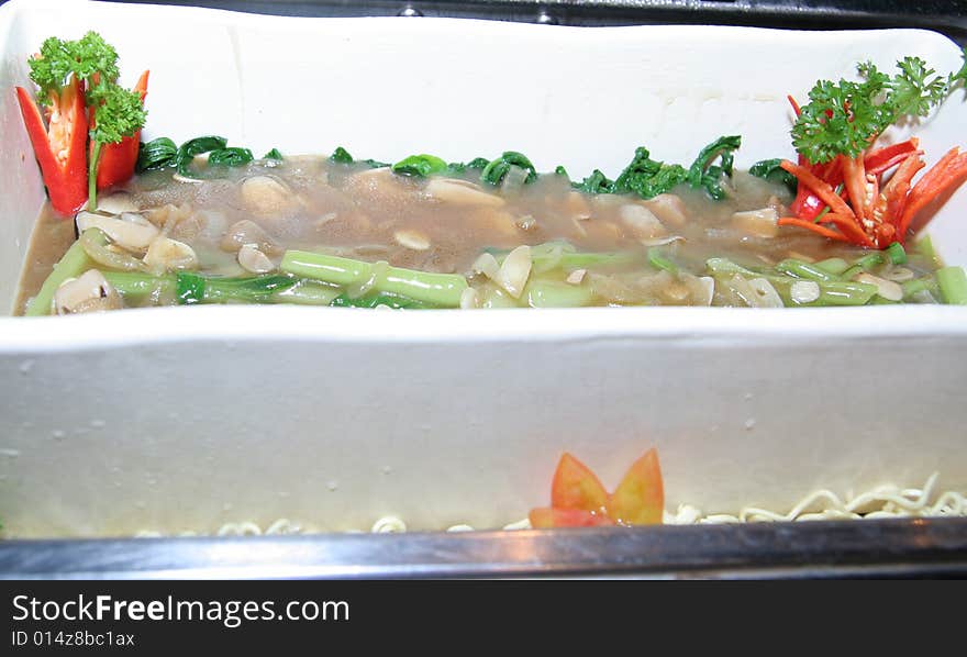 Photograph of soup in rectangular bowl in buffet. Photograph of soup in rectangular bowl in buffet