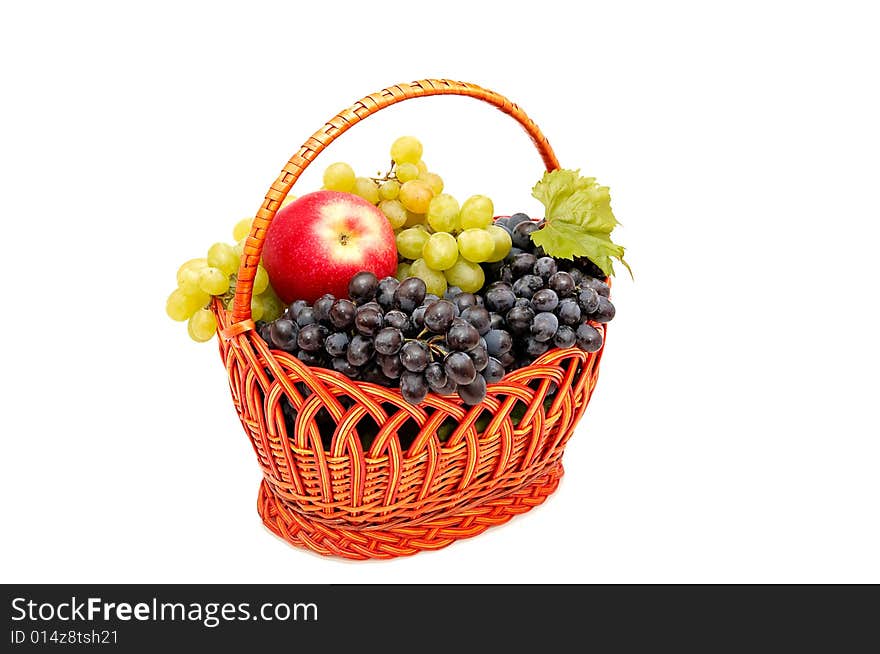 Bunches of grapes and apples in basket.