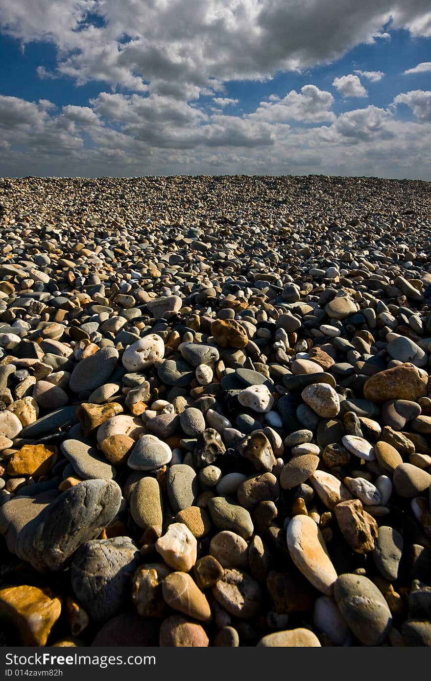 Pebbles with a nice cloudy sky. Pebbles with a nice cloudy sky