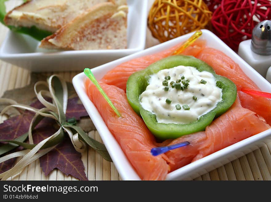 A breakfast of fresh salmon and some bread. A breakfast of fresh salmon and some bread