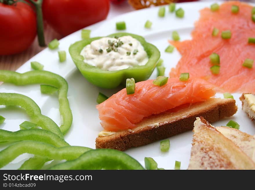 A breakfast of fresh salmon and some bread. A breakfast of fresh salmon and some bread