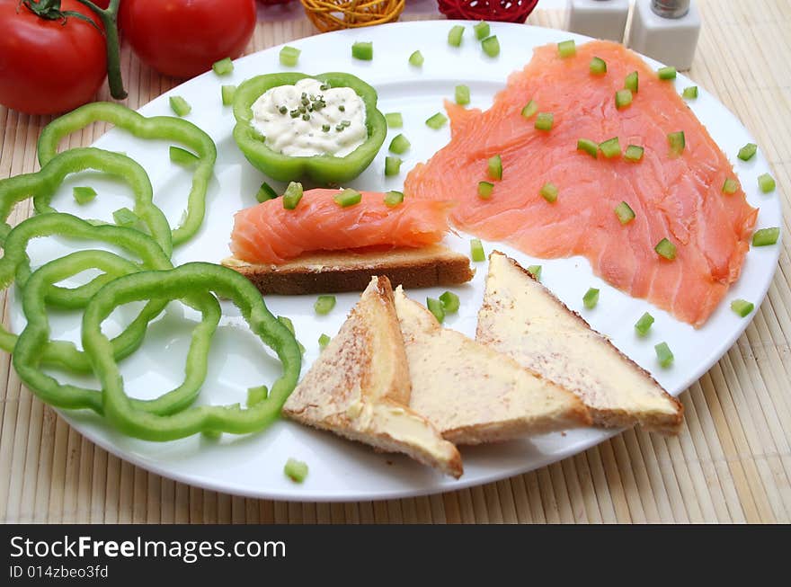 A breakfast of fresh salmon and some bread. A breakfast of fresh salmon and some bread