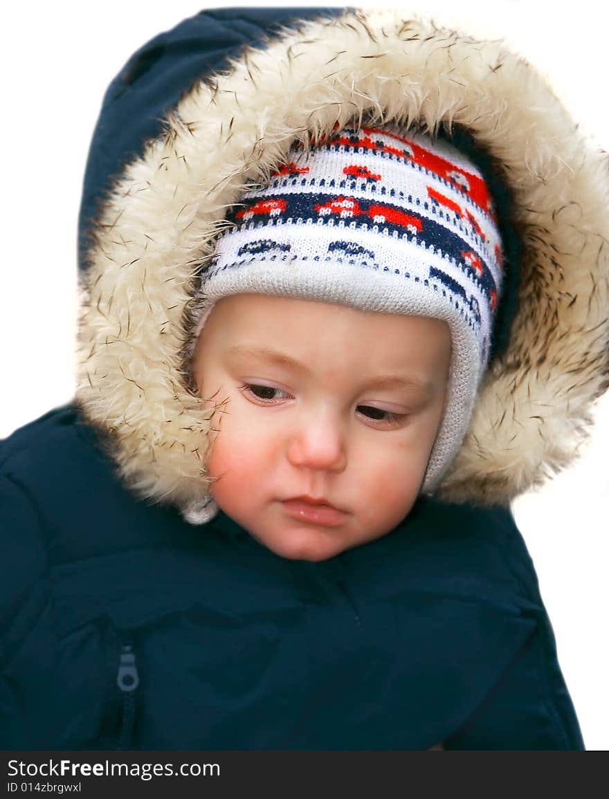 Baby boy in warm jacket over white