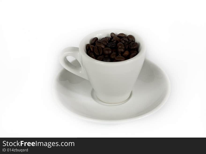 A cup of coffee beans isolated on white. A cup of coffee beans isolated on white