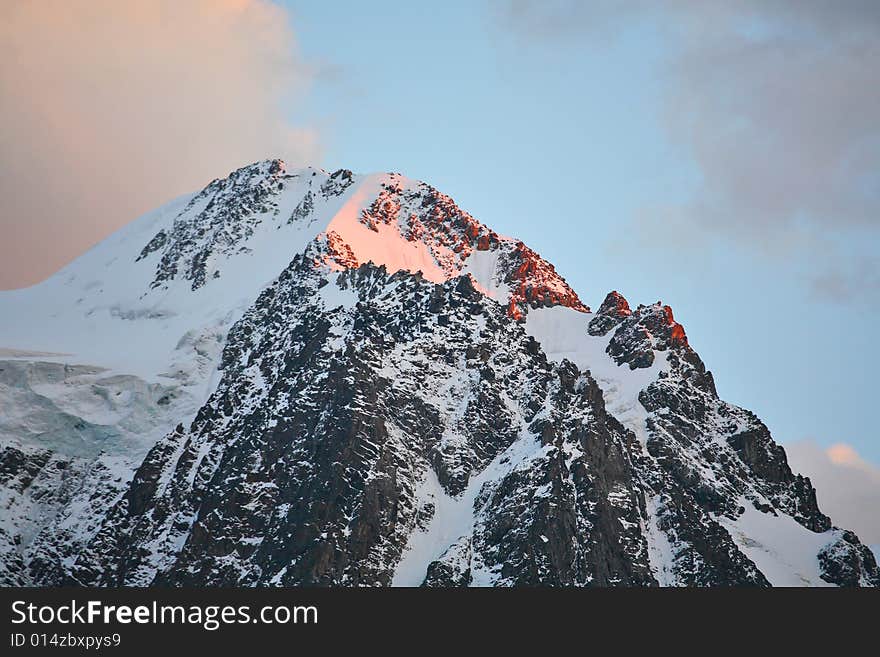 Mountain peak at sunset. Siberia, Altai mountains, Russia