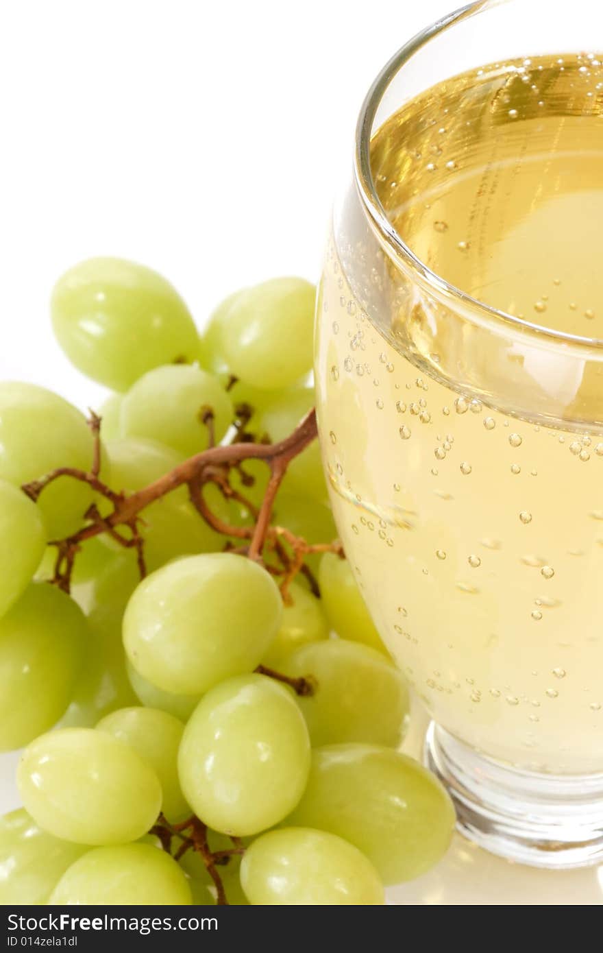 Spritzer in a glass with grapes on white background