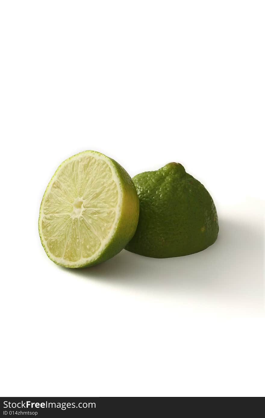 A green lime fruit sliced, isloated on a white background