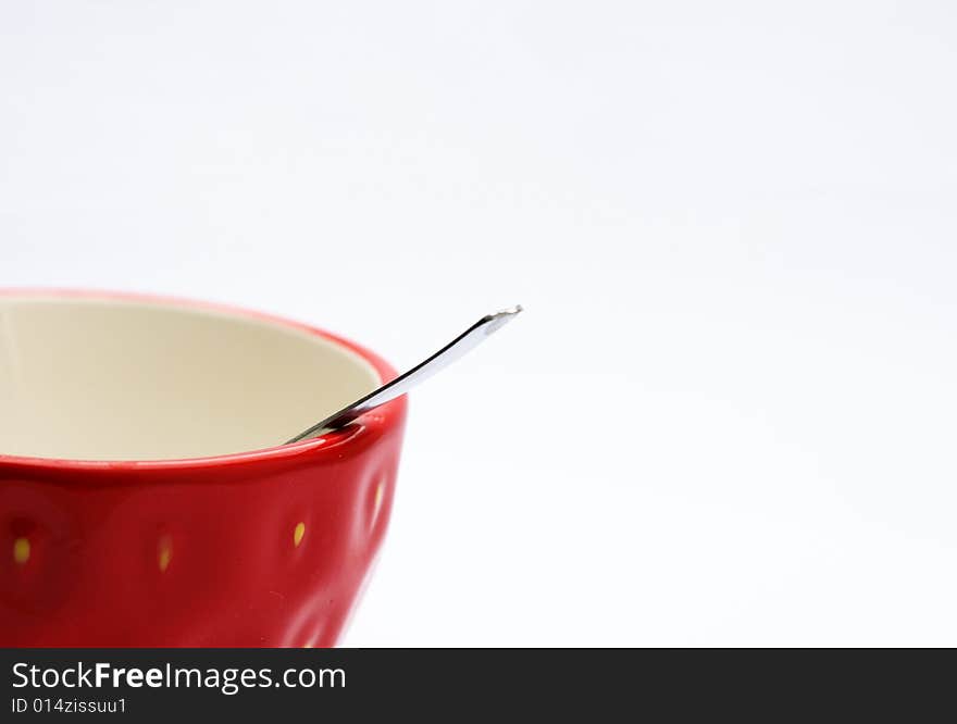 Red cup with spoon - isolated