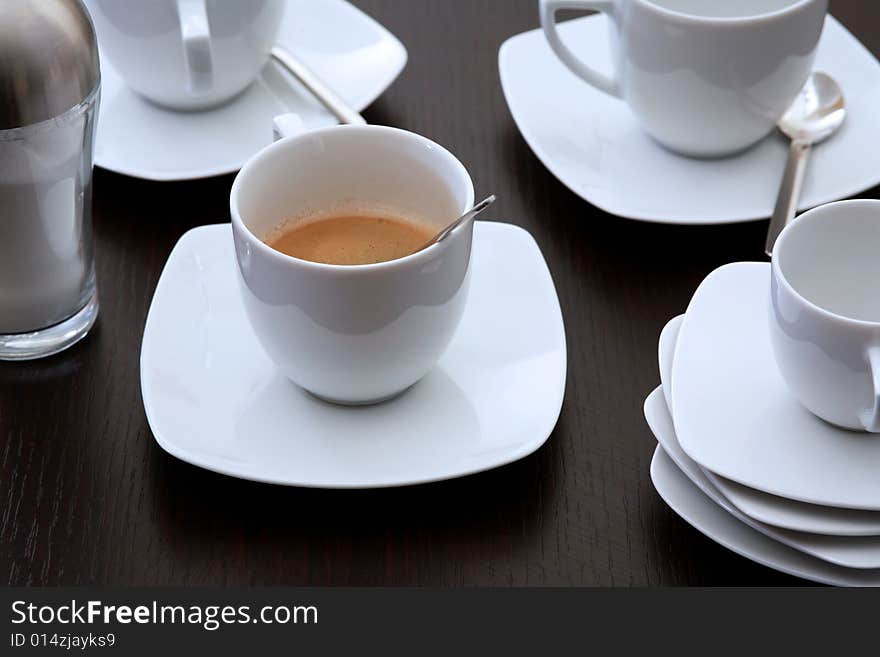 Capucchino cup on a brown table