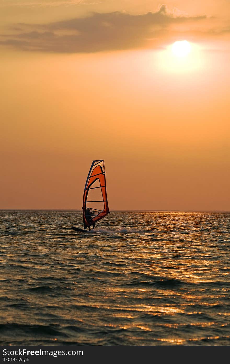 Silhouette of a windsurfer