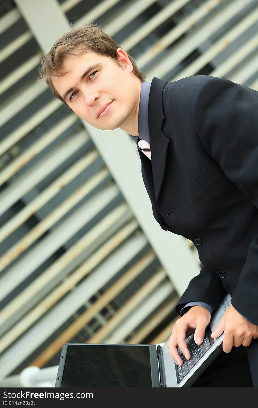 Business background: handsome businessman in a work process. Business background: handsome businessman in a work process.