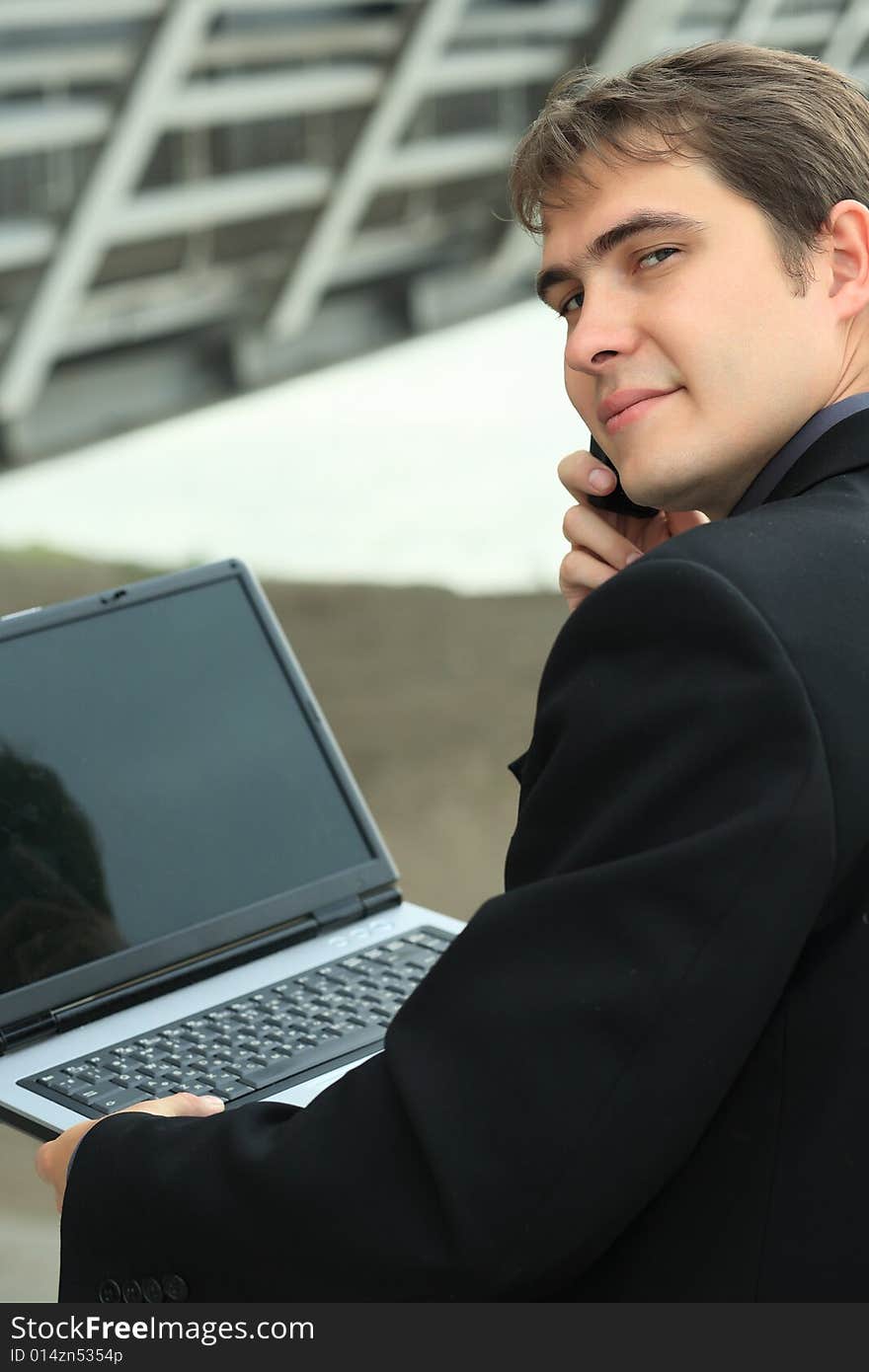 Business background: handsome businessman in a work process. Business background: handsome businessman in a work process.