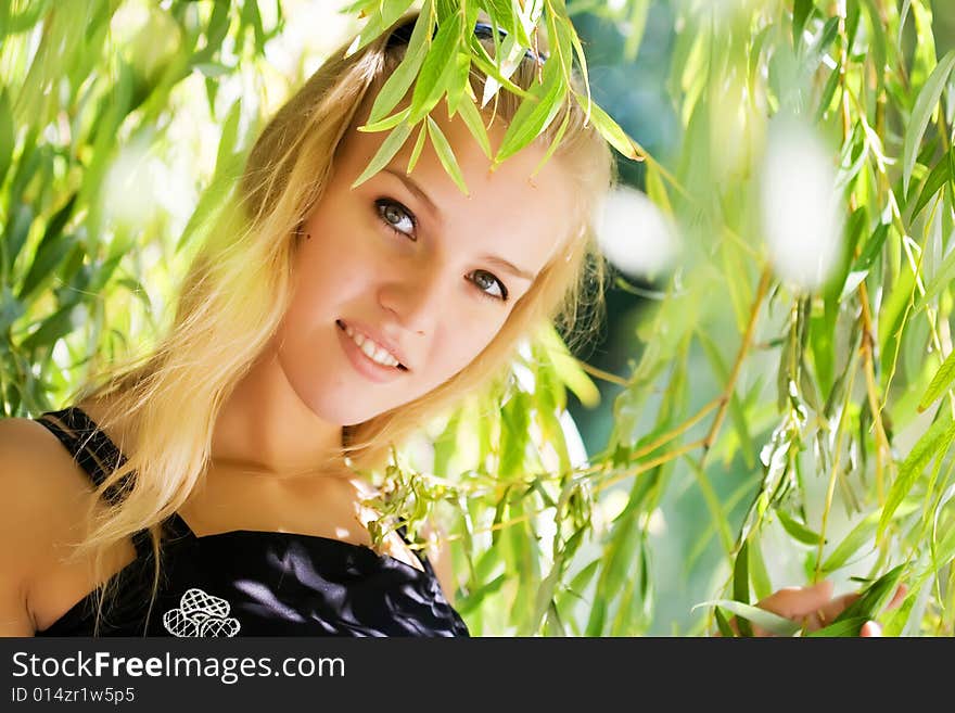 Girl in green willow's leaves. Girl in green willow's leaves