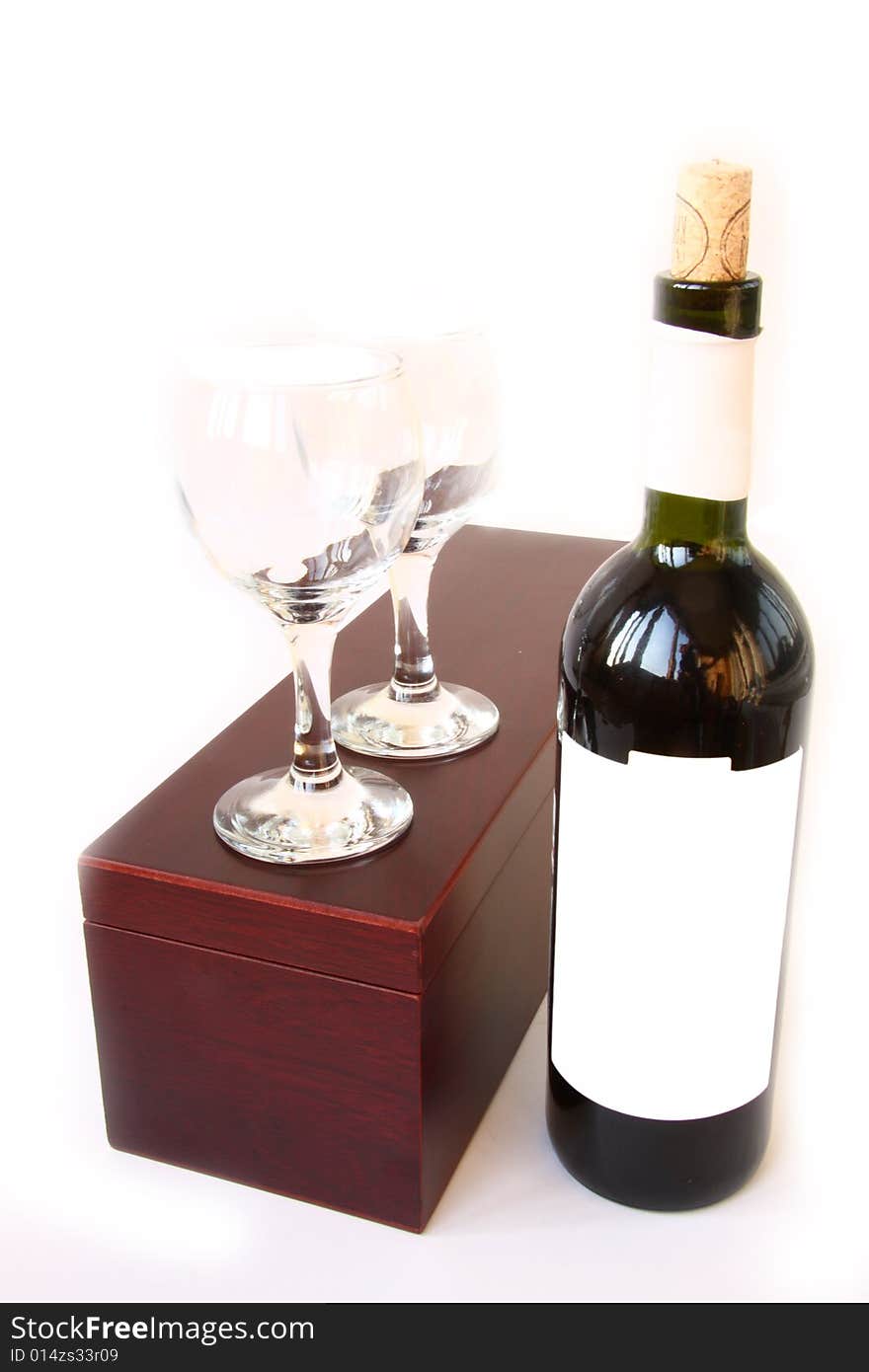 Red wine bottle and box at white