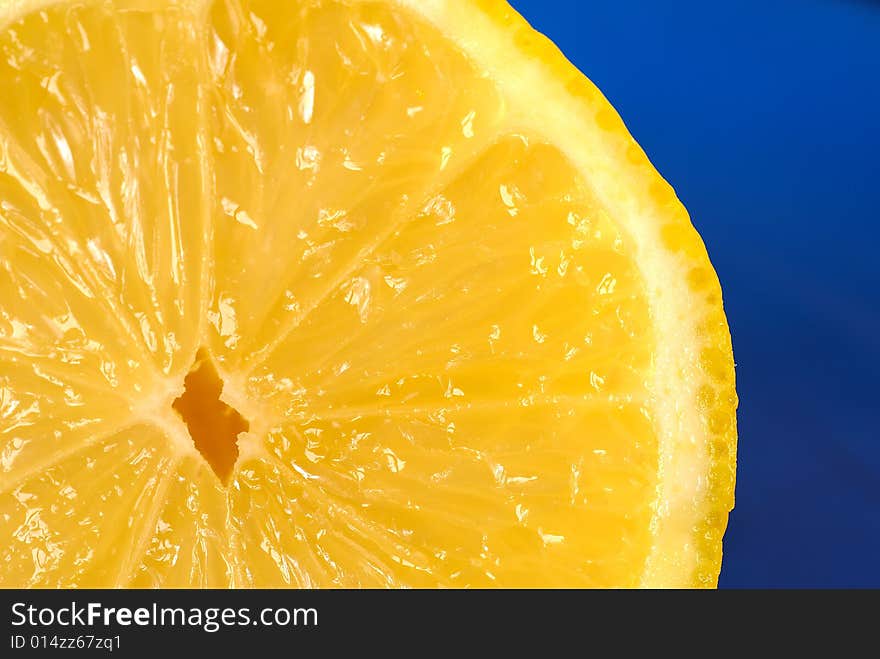 Slice of lemon on blue plate