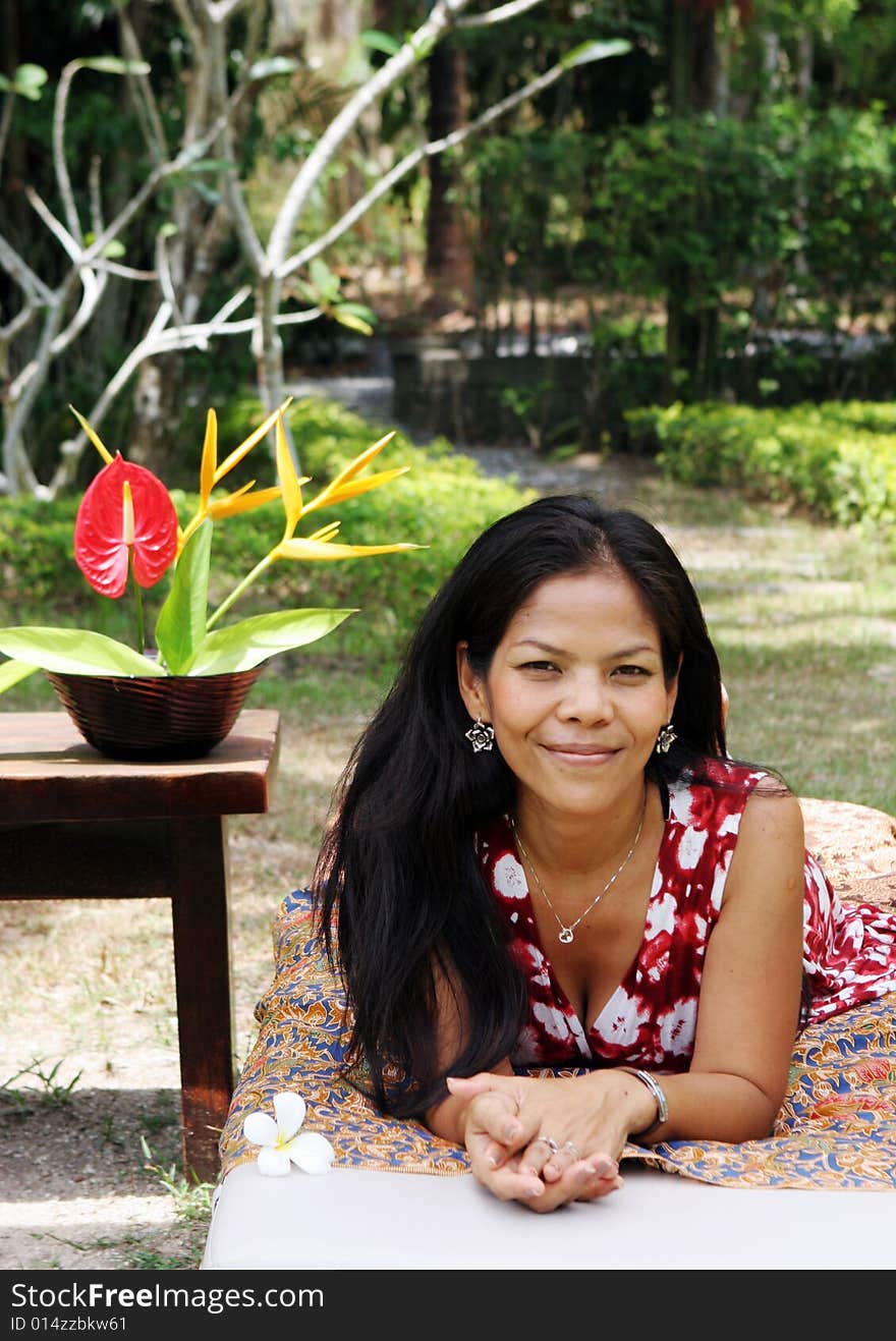 Beautiful Thai woman relaxing at a day spa.