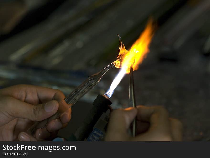 Artist shaping glass