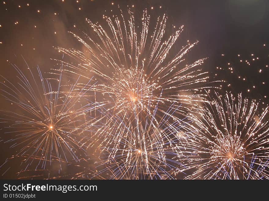 A red firework exploding at night. A red firework exploding at night