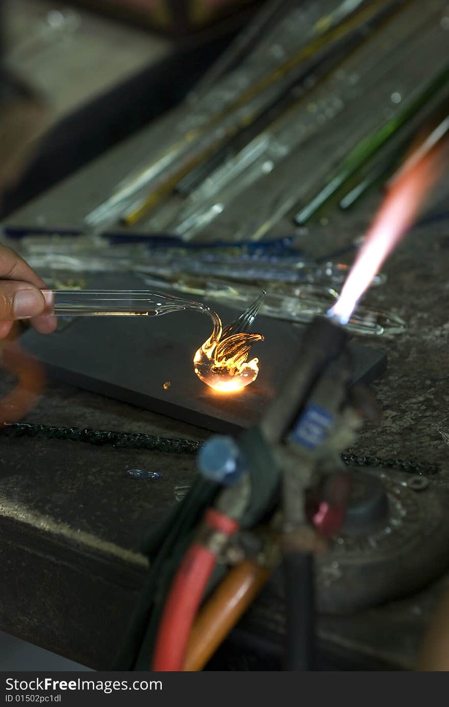 Artist shaping glass