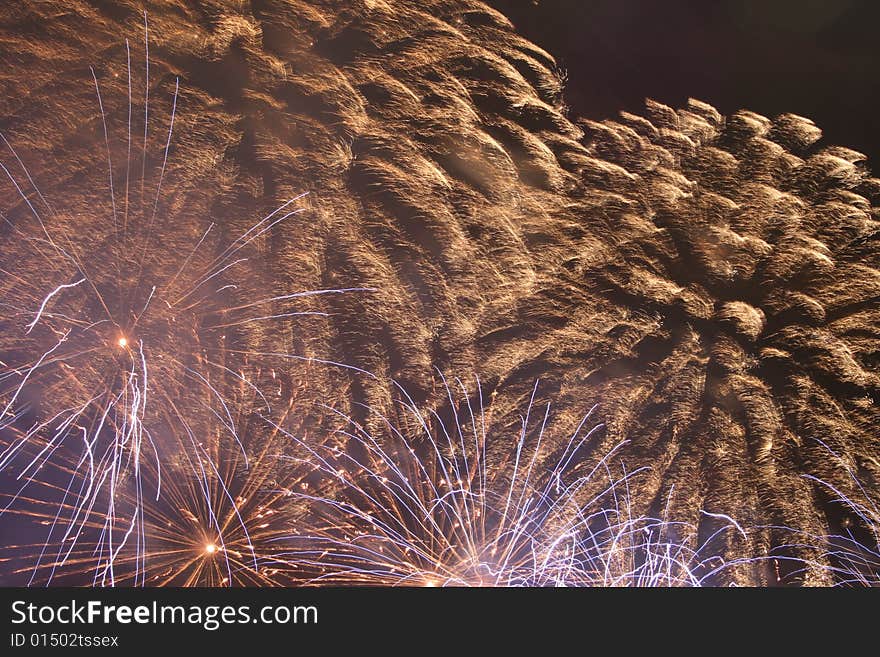 A red firework exploding at night. A red firework exploding at night