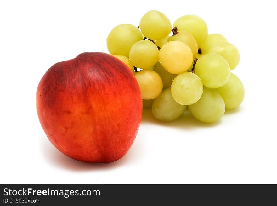 Grapes and peach isolated on white background