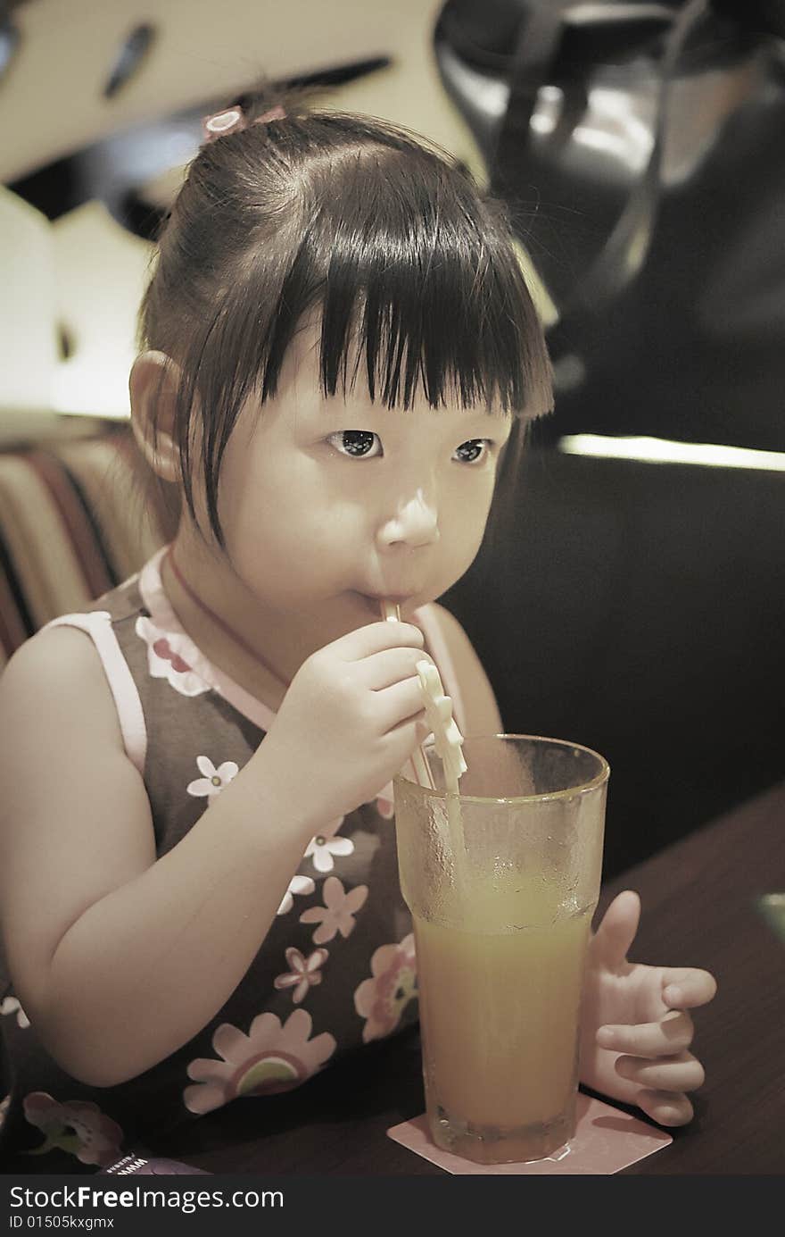 Child drink orange syrup