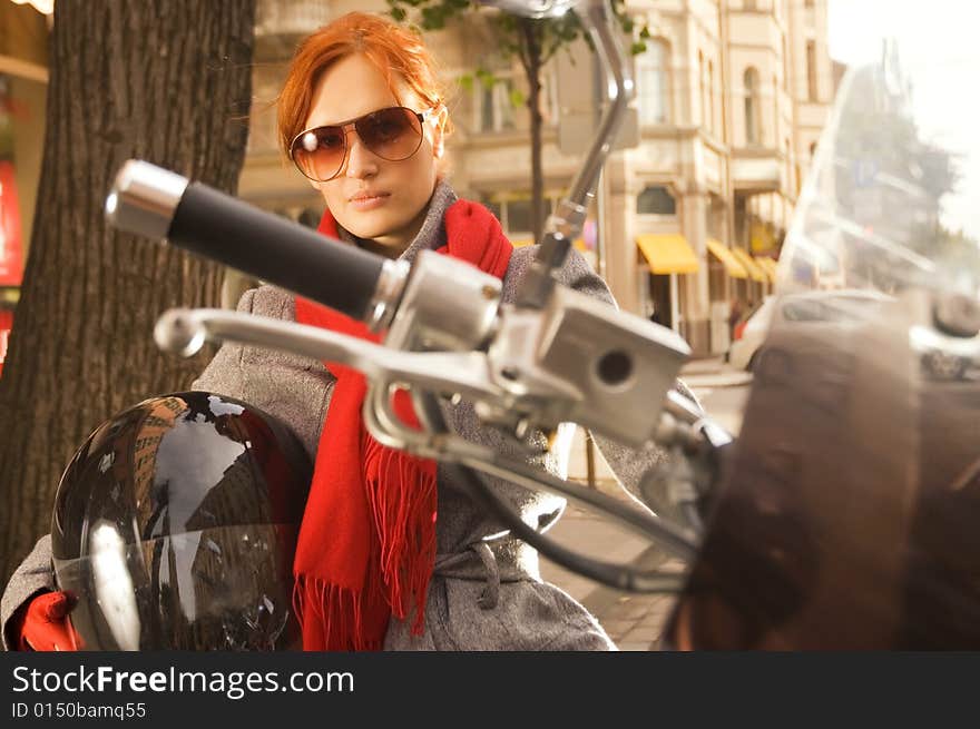 Beautiful woman on the motorcycle (focus on the hand)