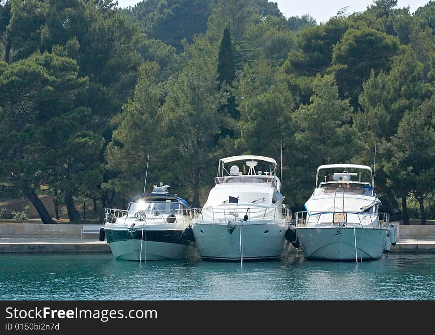 Photo of three yachts anchored at the berth. Photo of three yachts anchored at the berth