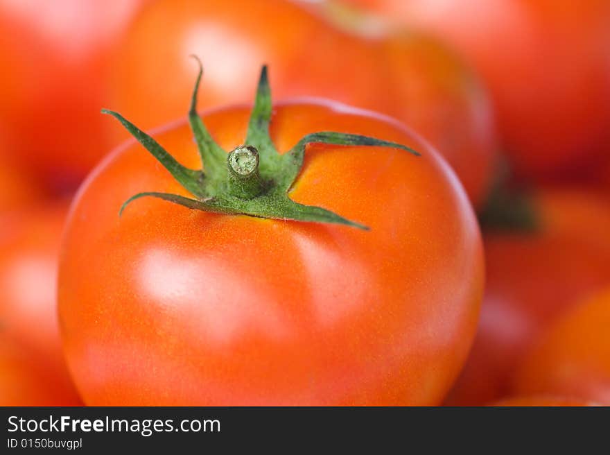 A batch of fresh red tomatoes