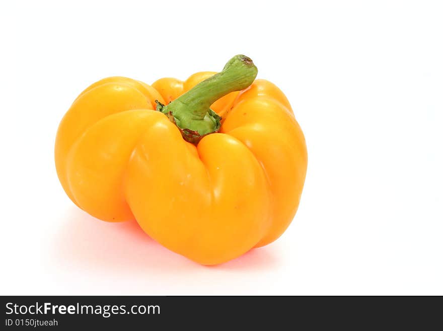 Single yellow paprika isolated on the white background