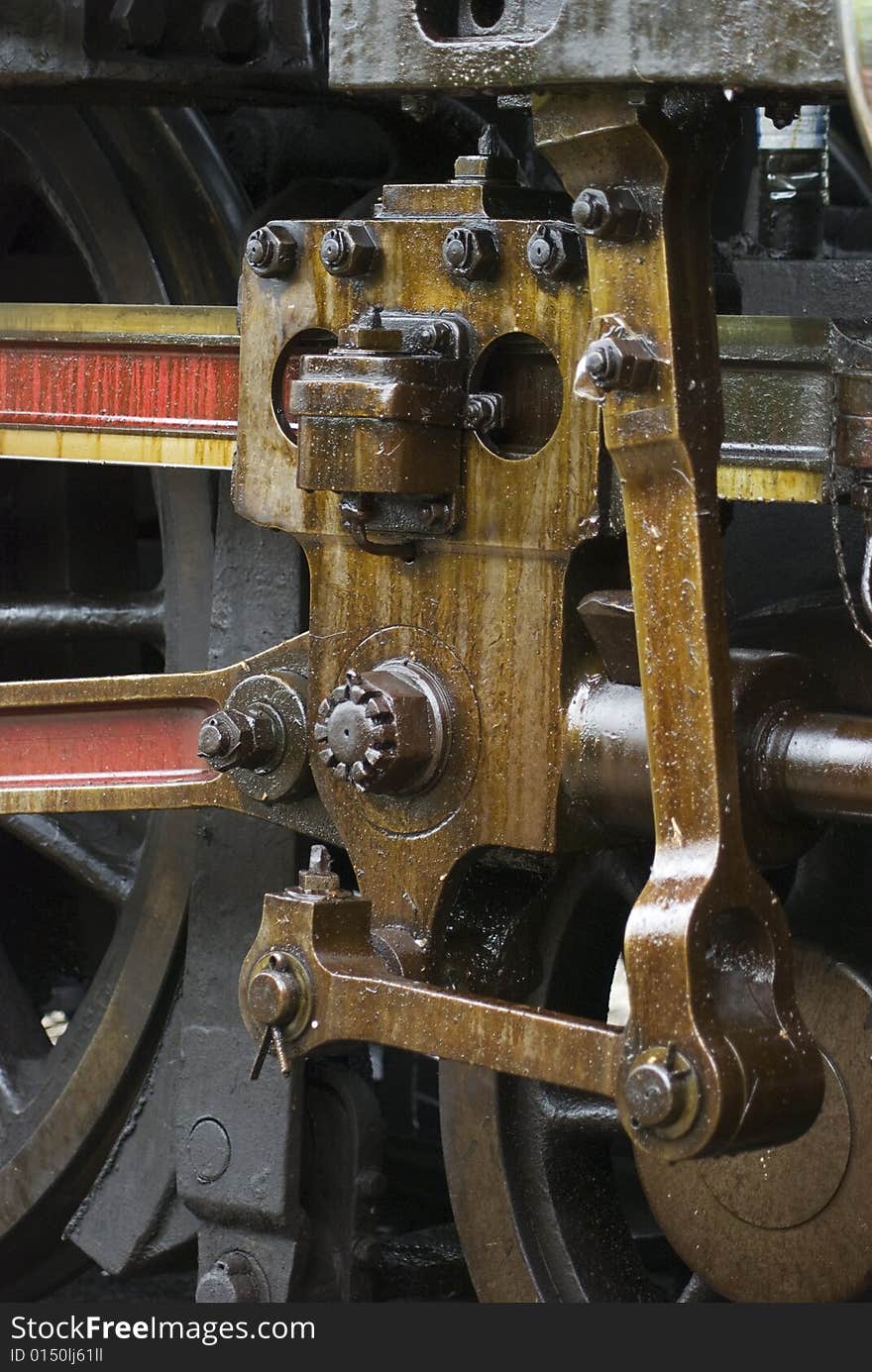 Running gear of old steam engine stained by oil used for lubrication. Running gear of old steam engine stained by oil used for lubrication.