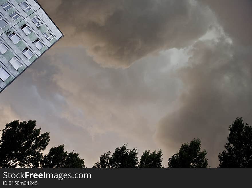 Dark, heavy rain clouds above flat. Dark, heavy rain clouds above flat