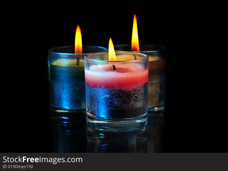 Various Candles over black background