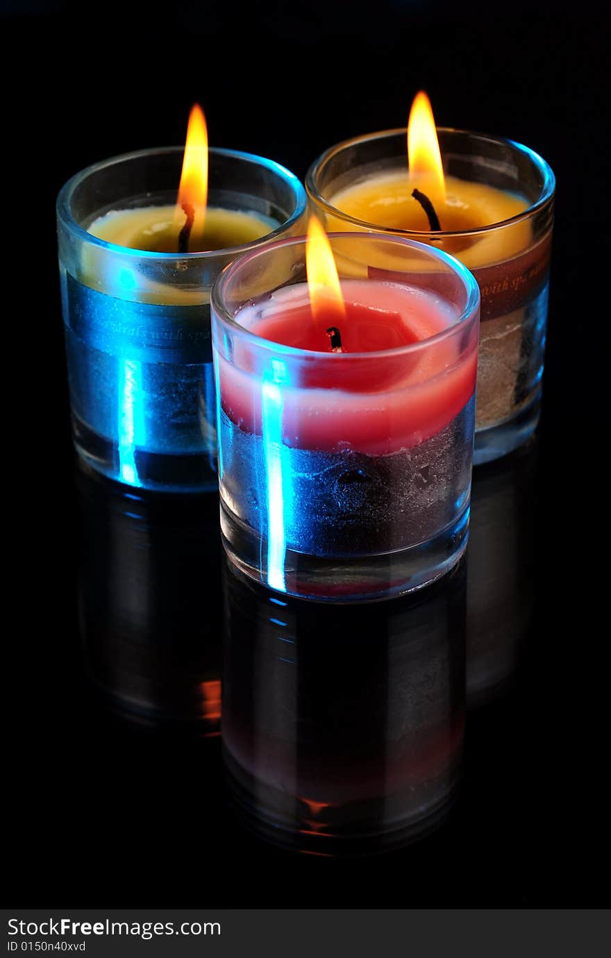 Various Candles over black background