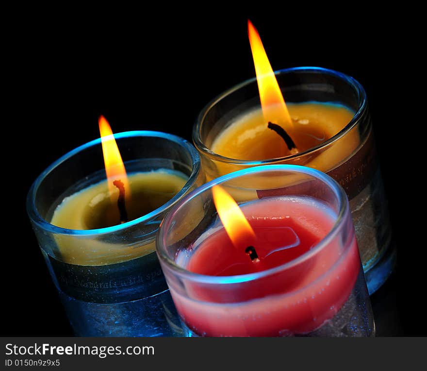 Various Candles over black background