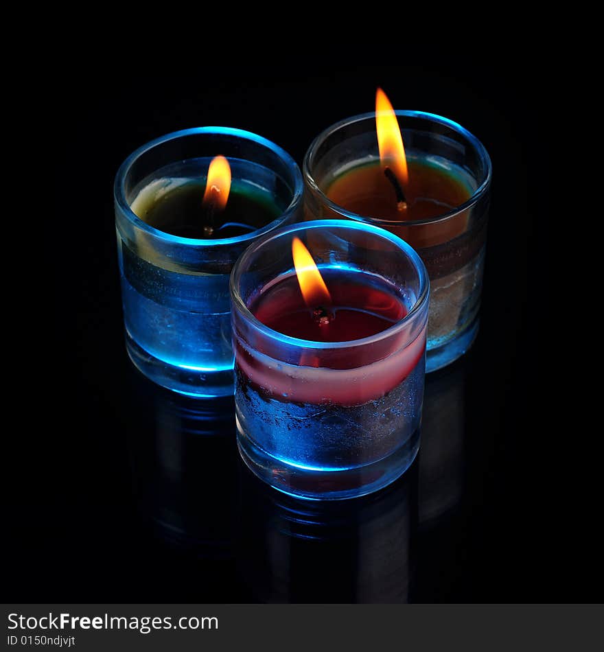 Various Candles over black background