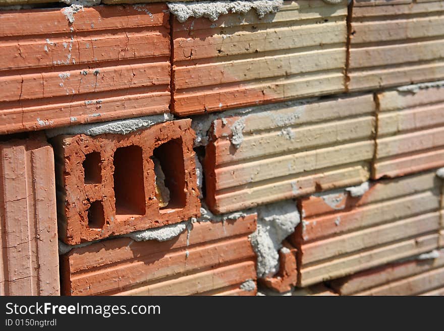 A red brick in the wall. A red brick in the wall.