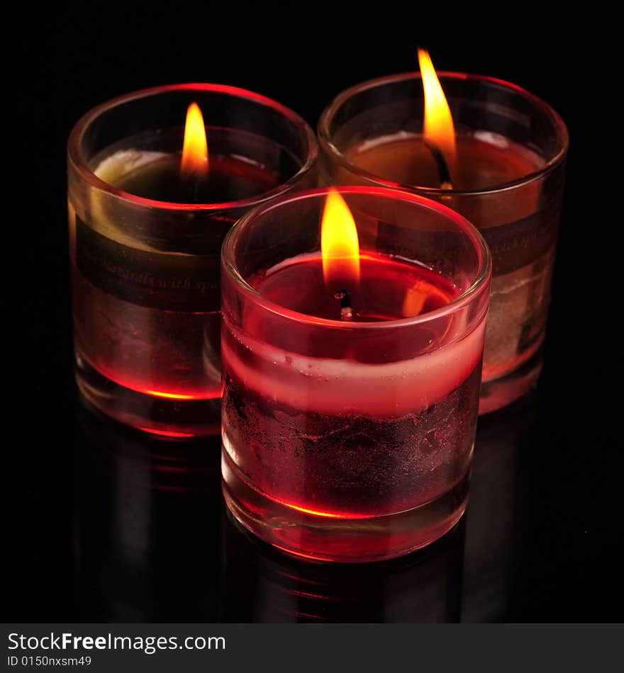 Various Candles over black background