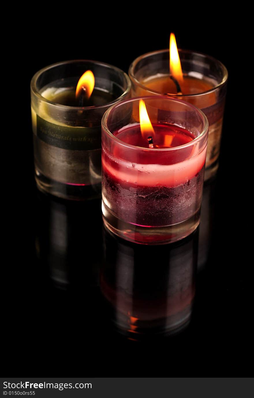 Various Candles over black background