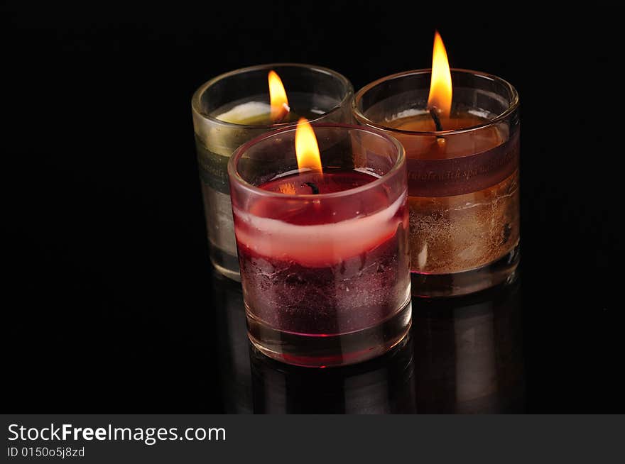 Various Candles over black background