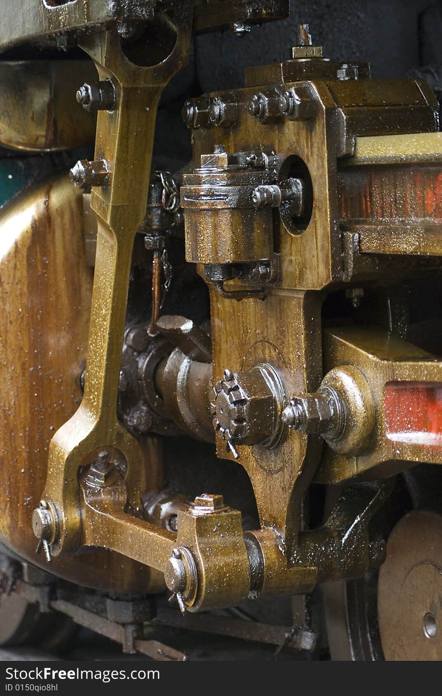 Running gear of old steam engine stained by oil used for lubrication. Running gear of old steam engine stained by oil used for lubrication.