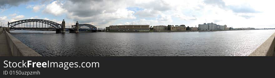 Panorama of the river Neva around Peter the Great bridge in Saint-Petersburg