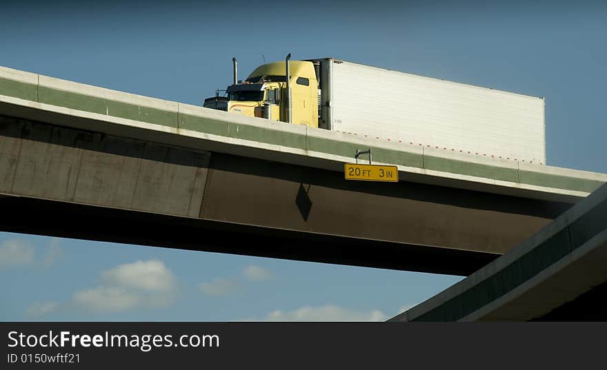 Yellow eighteen wheeler