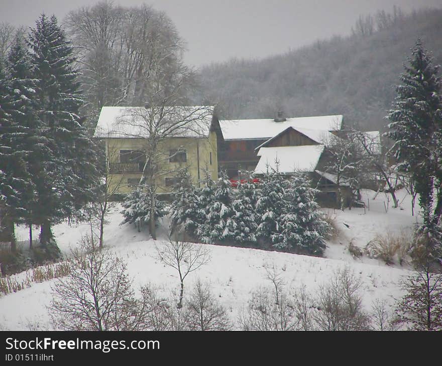 Tiny Bosnian village during snowy winter, single estate. Tiny Bosnian village during snowy winter, single estate