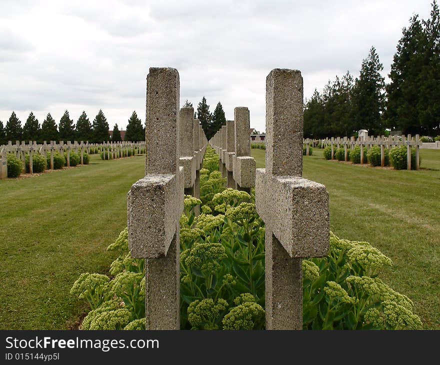 A row of crosses in the Montdidier National Cemetery in Montdidier, France. A primarily French cemetery but also includes Canadian graves and one German grave.