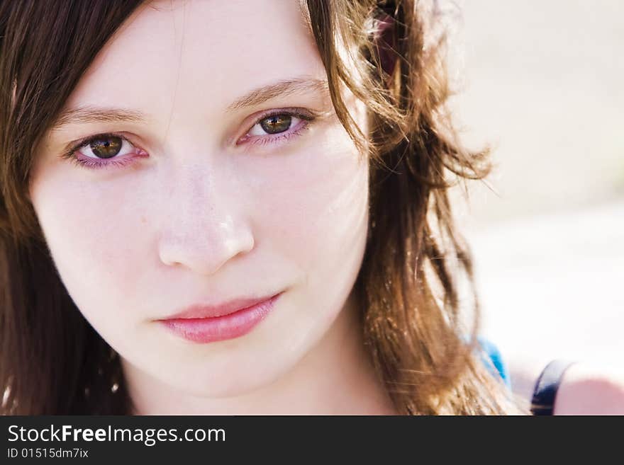 Young beautiful green eyed woman portrait.