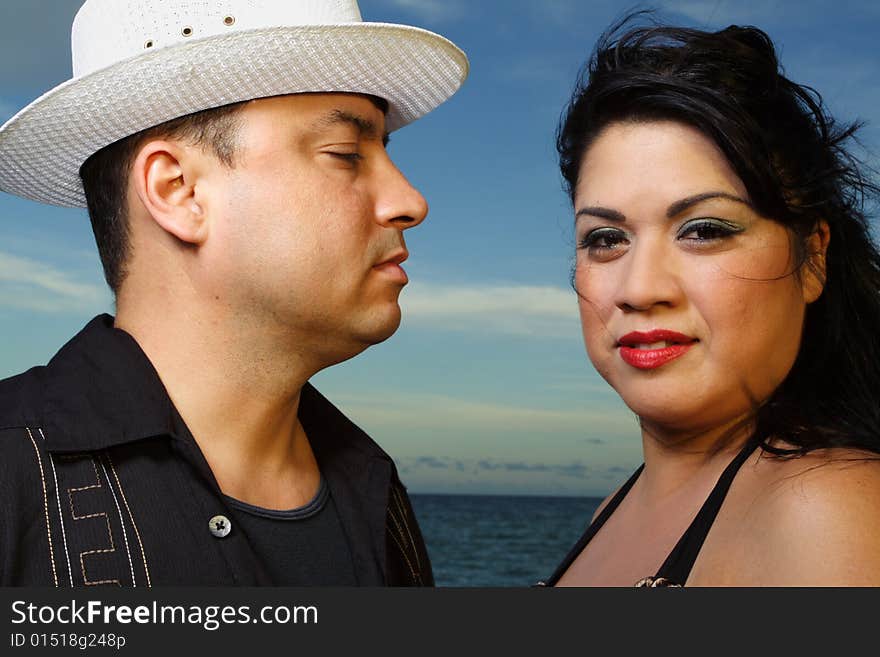 Young couple on a beautiful sky background. Young couple on a beautiful sky background