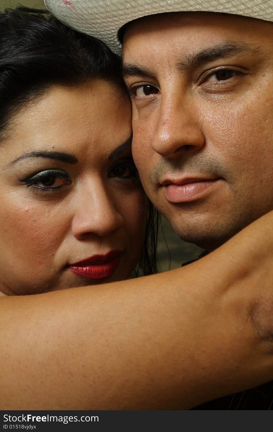 Headshot of two people looking at the camera. Headshot of two people looking at the camera