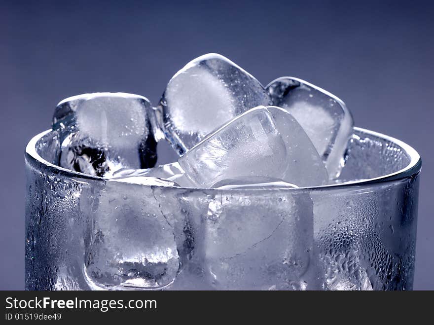 Ice cubes in glass in black background