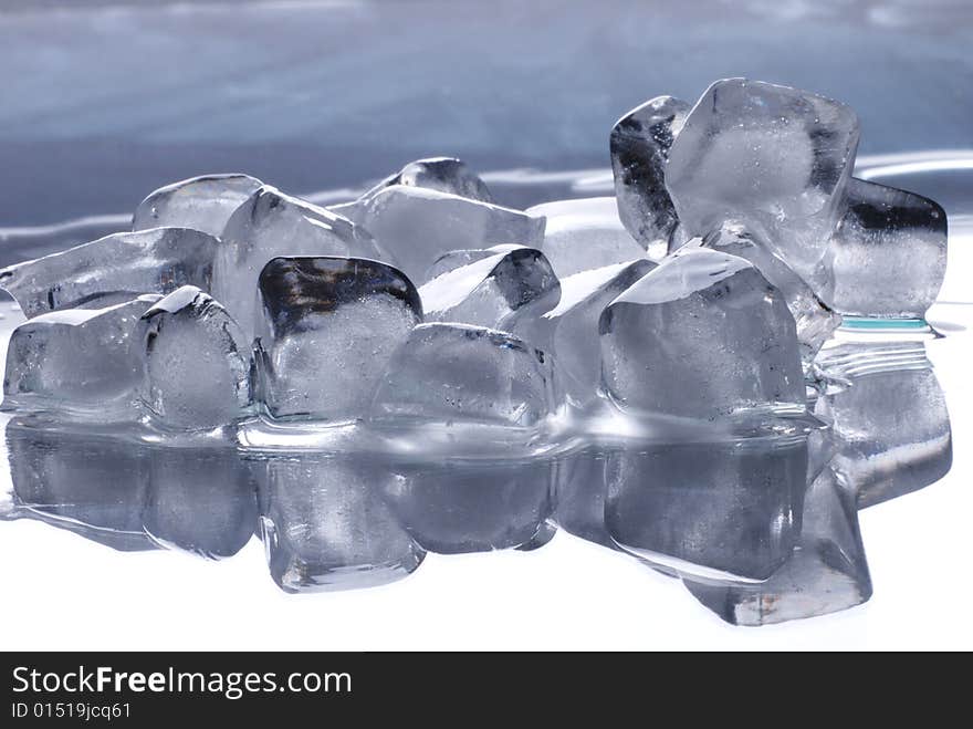 Ice cubes in smooth reflected  background